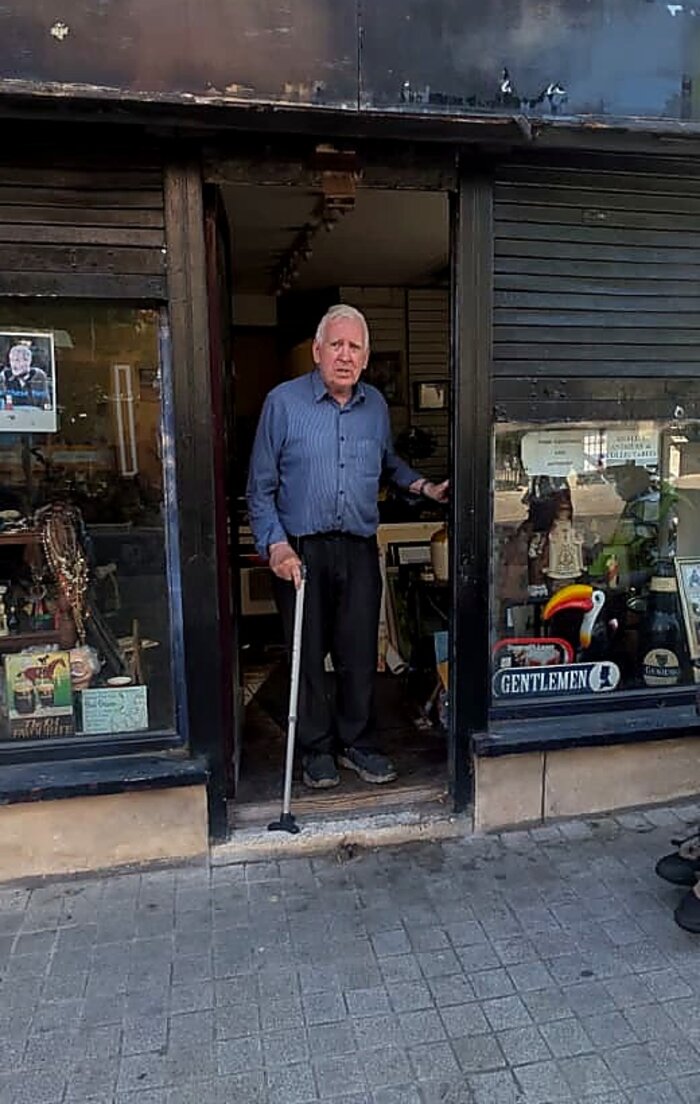 Tommy Dempsey standing in the doorway of Tom's Curios on Francis Street