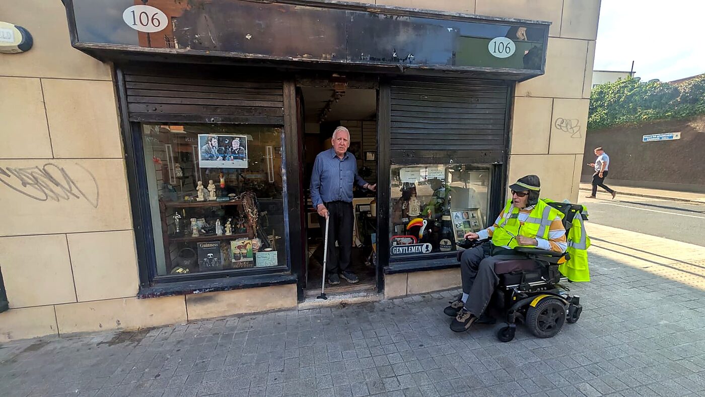 Tom's Curios shopfront at 106 Francis Street, Dublin, with owner Tommy Dempsey in the doorway